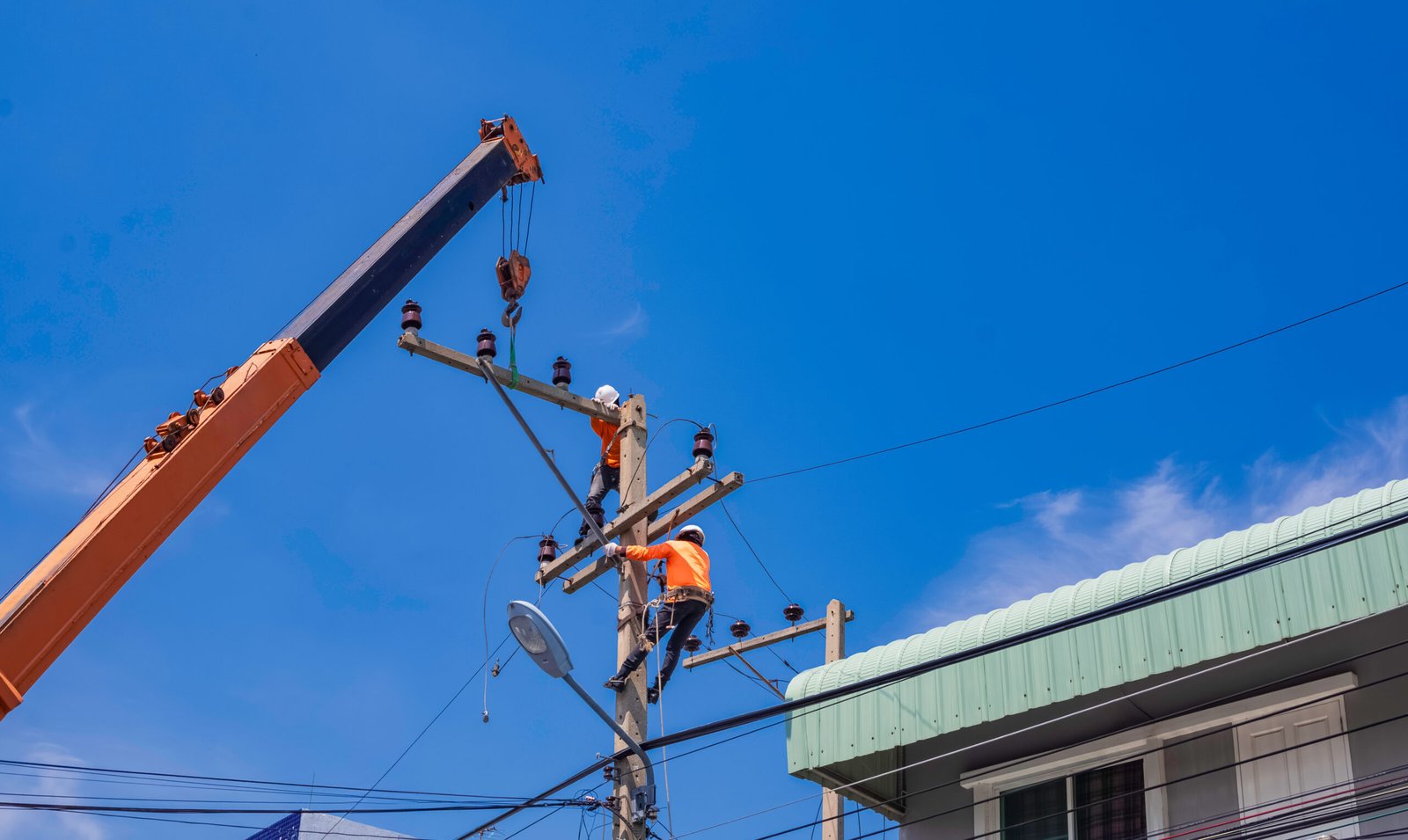 two electricians with crane truck are installing e 2026 01 08 22 08 19 utc scaled